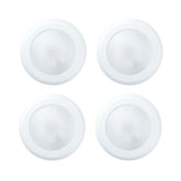 Four white circular objects on a white background at fliptoled