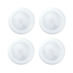 Four white circular objects on a white background at fliptoled