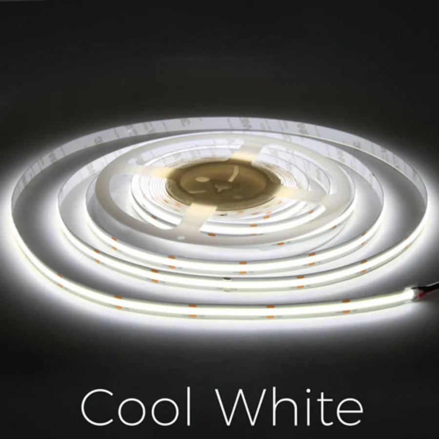 Roll of cool white LED strip light on a dark background
