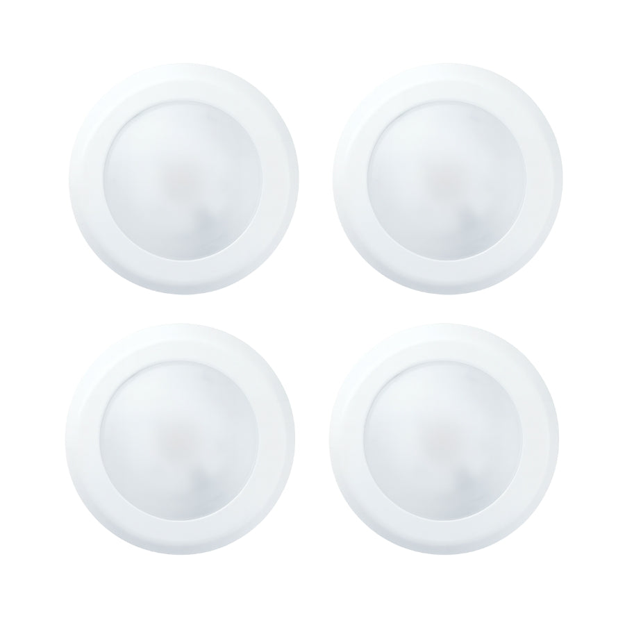 Four white circular objects on a white background at fliptoled