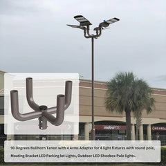 Outdoor LED shoebox pole lights with a 90 Degrees Bullhorn Tenon adapter in front of a building.