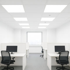 Modern office space with white desks, black chairs, and computer monitors. led backlit panel light