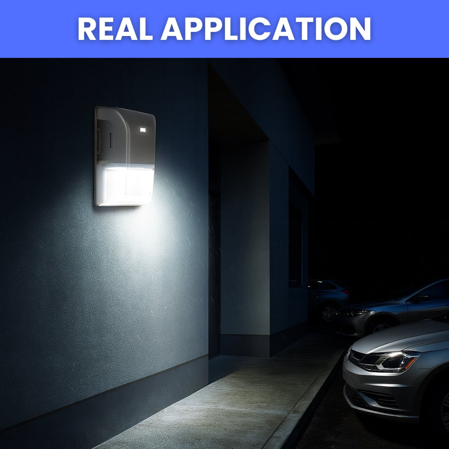 Wall-mounted security light illuminating a dark alleyway with parked cars. led mini wall pack light 20w with photocell in usa​

